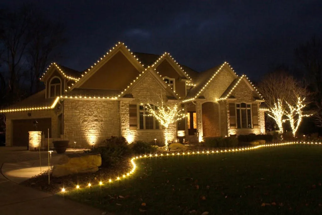 Christmas light installation on a residential home