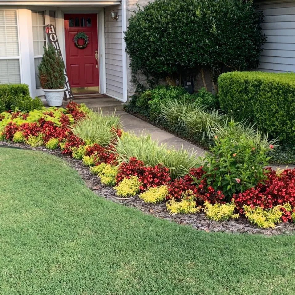 Residential lawn and flowerbed maintained by Executive Lawn Care
